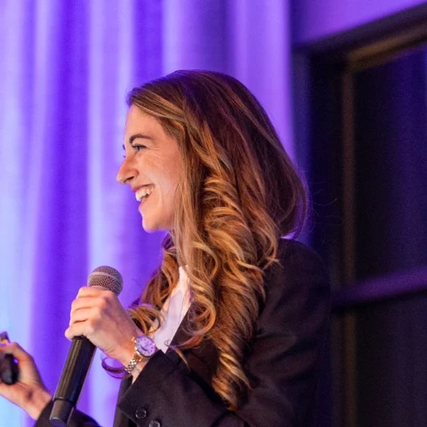 Kristin Messerli speaking on stage